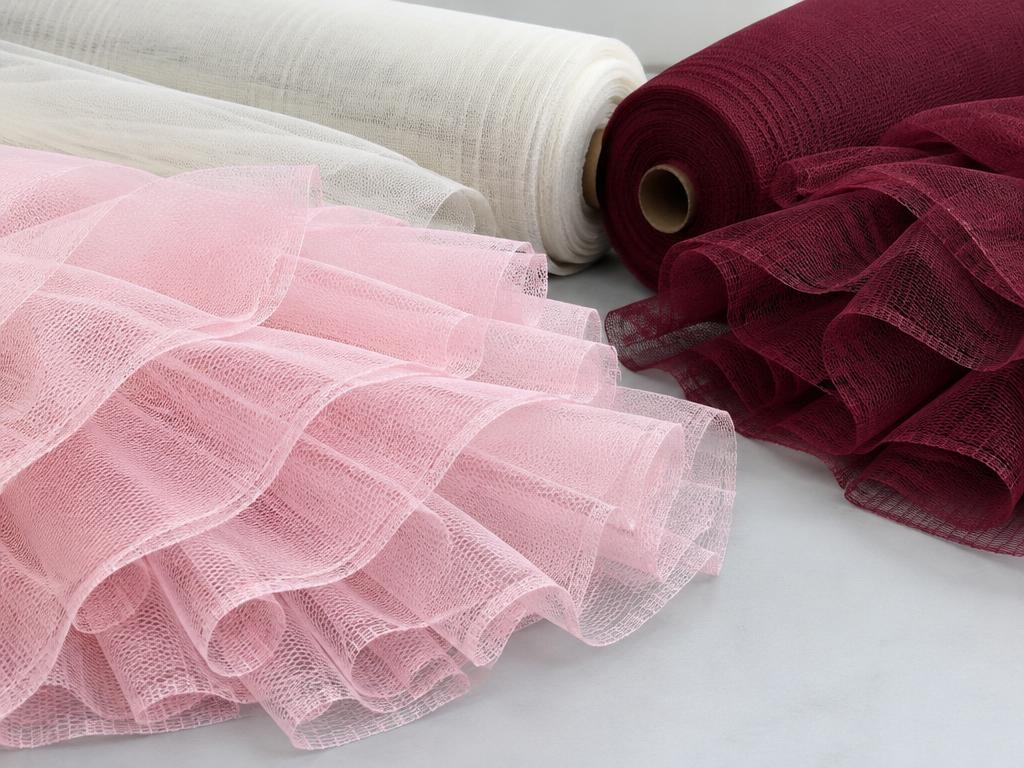 Rolls and folds of structured mesh can-can fabric